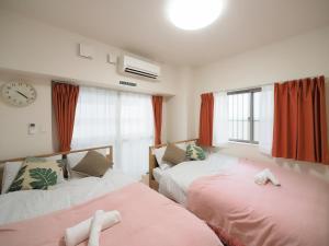 Ένα ή περισσότερα κρεβάτια σε δωμάτιο στο Daruma apartment 403
