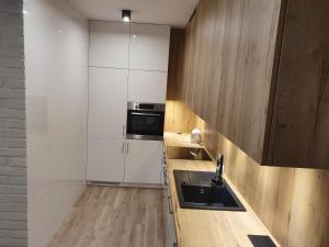 Kuchyňa alebo kuchynka v ubytovaní Apartament nad Sapiną