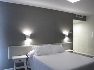 Posteľ alebo postele v izbe v ubytovaní Hotel Ton