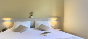 Ein Bett oder Betten in einem Zimmer der Unterkunft DIEHOLIDAYBUCHT