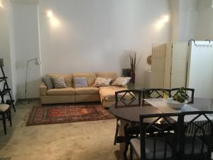 a living room with a couch and a table at Salento apartment '800 in Campi Salentina