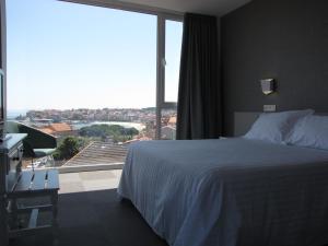 Posteľ alebo postele v izbe v ubytovaní Hotel Ton