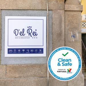 a sign on the side of a building with a clean and safe sign at D' El Rei B&B in Matosinhos