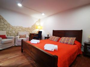 a bedroom with a large bed with towels on it at Proserpina in Enna