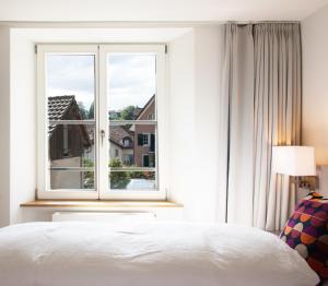 Postel nebo postele na pokoji v ubytování Haus am Schlossberg