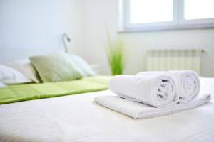 Posteľ alebo postele v izbe v ubytovaní Villa Perla