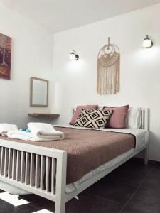 a bedroom with a large bed in a room at Katsikantaris Homes in Paphos