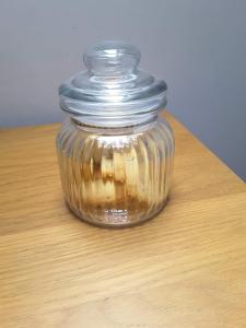 a jar of food sitting on a wooden table at The Hayloft in Hornsea