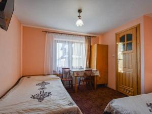 Posteľ alebo postele v izbe v ubytovaní Pokoje Gościnne Jaworowy