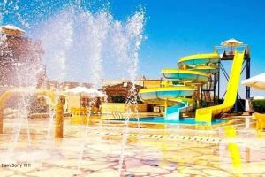 a water park with a water slide at Green Leaves Hotel in Dawwār Abū Duray‘ah ‘Abd al Karīm
