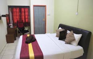 Postel nebo postele na pokoji v ubytování Camlodge Budget Hotel