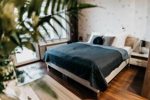 A bed or beds in a room at AH Radnica II Free Parking