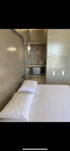 a bedroom with a white bed in a room at Blue Sky in Ios Chora