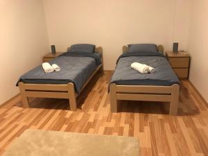 Postel nebo postele na pokoji v ubytování Apartmani & SPA Matin Breg