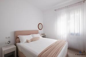 A bed or beds in a room at Cavo Milos