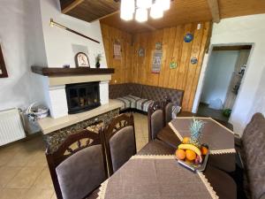 a dining room with a table with a pineapple on it at Zorianyy Guest House in Mykulychyn