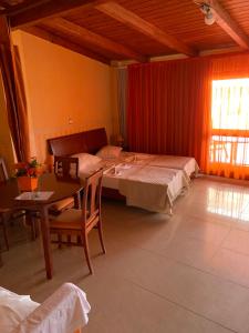 Postel nebo postele na pokoji v ubytování Village Dimopoulos