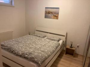 Кровать или кровати в номере Patrik Apartment Šamorín