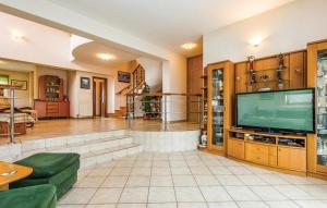 a living room with a flat screen tv at Lux apartman LEO in Kostrena