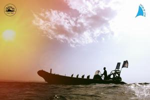 a group of people on a boat in the water at Stylish Garden Apartment Close to Akhziv Beach by Sea N' Rent in Nahariyya