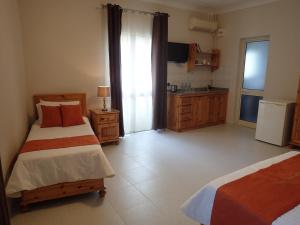 Ένα ή περισσότερα κρεβάτια σε δωμάτιο στο Duncan Guesthouse