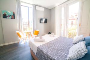 Vuode tai vuoteita majoituspaikassa Apartments Madrid Plaza Mayor-Tintoreros