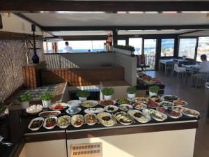 a buffet with many plates of food on a counter at Fehmi Bey Suites in Istanbul