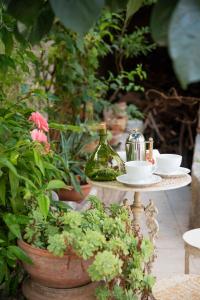 a table with two cups and a teapot on it at Silva Apartments in Alberobello