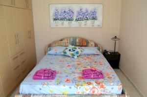 Postel nebo postele na pokoji v ubytování Villa Eytychia