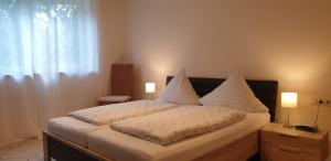 Postel nebo postele na pokoji v ubytování GardenView Apartments & Suites bei Bad Kissingen