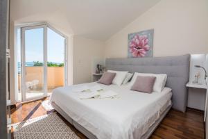 Postel nebo postele na pokoji v ubytování Apartments Medanić - Private Pool + 37 fotografií