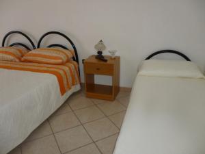 Postel nebo postele na pokoji v ubytování Villetta Marika