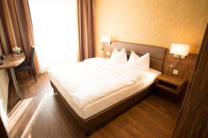 Ein Bett oder Betten in einem Zimmer der Unterkunft Hotel Amaris
