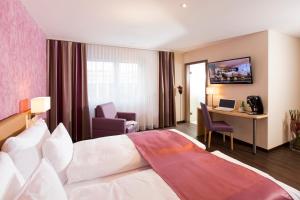 Ένα ή περισσότερα κρεβάτια σε δωμάτιο στο Hotel Amaris