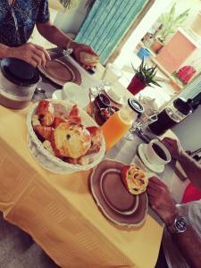 a table with a plate of food on it at La Chamberte in Villeneuve-lès-Béziers