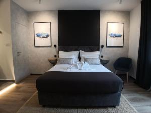 Posteľ alebo postele v izbe v ubytovaní Scuderia Split Rooms