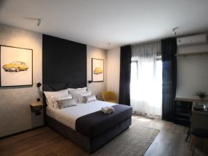 Posteľ alebo postele v izbe v ubytovaní Scuderia Split Rooms