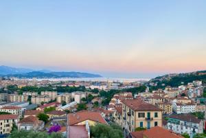 a cityscape of a city at sunset at Cá Leon in La Spezia