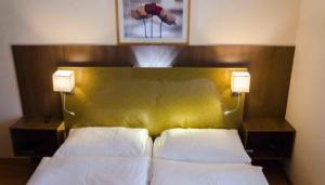 Postel nebo postele na pokoji v ubytování Zys Hotel