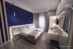 A bed or beds in a room at HOLYGOLD Suite ****