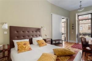 En eller flere senge i et værelse på Mouzinho 244 - Porto Houses & Suites