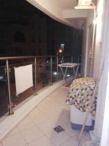 a view of a balcony at night with a table at Costa Marina 212 in Hammamet