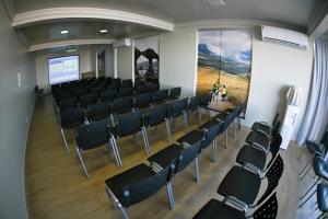 an empty room with chairs and a projection screen at Hotel Orla do Rio Branco in Boa Vista
