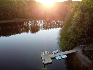 an aerial view of a lake with a dock at Przystań Piecek in Stręgielek