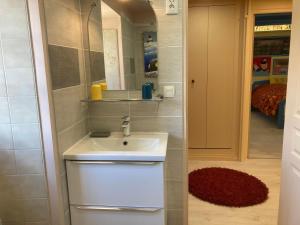 a bathroom with a sink and a mirror at Moulin des Baleines de Kérandraon Plouguerneau in Plouguerneau +52 photos