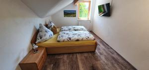 Postel nebo postele na pokoji v ubytování Alpine Lodge Wertach