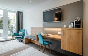 TV a/nebo společenská místnost v ubytování AVALON Hotel Bad Reichenhall