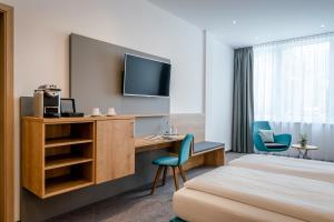 Postel nebo postele na pokoji v ubytování AVALON Hotel Bad Reichenhall