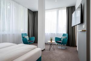 TV a/nebo společenská místnost v ubytování AVALON Hotel Bad Reichenhall