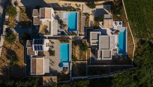 an overhead view of a house with a pool at Mimi and Coco Villas Corfu in Paramonas